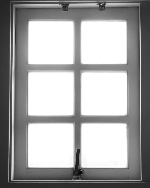 black and white po of a window and lamp