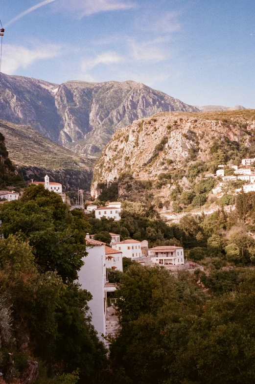 buildings sit along the bank of a canyon