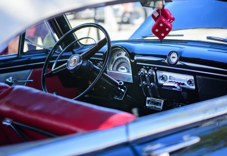 a car's dashboard in front of other cars and on the road