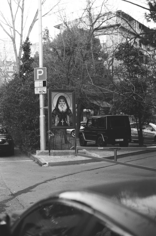 an old black and white po of a car at the intersection