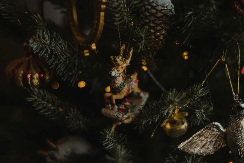 an array of ornaments hanging on a christmas tree