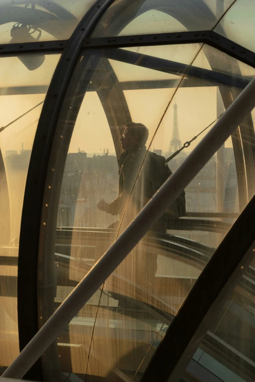 a man standing inside a large metal structure