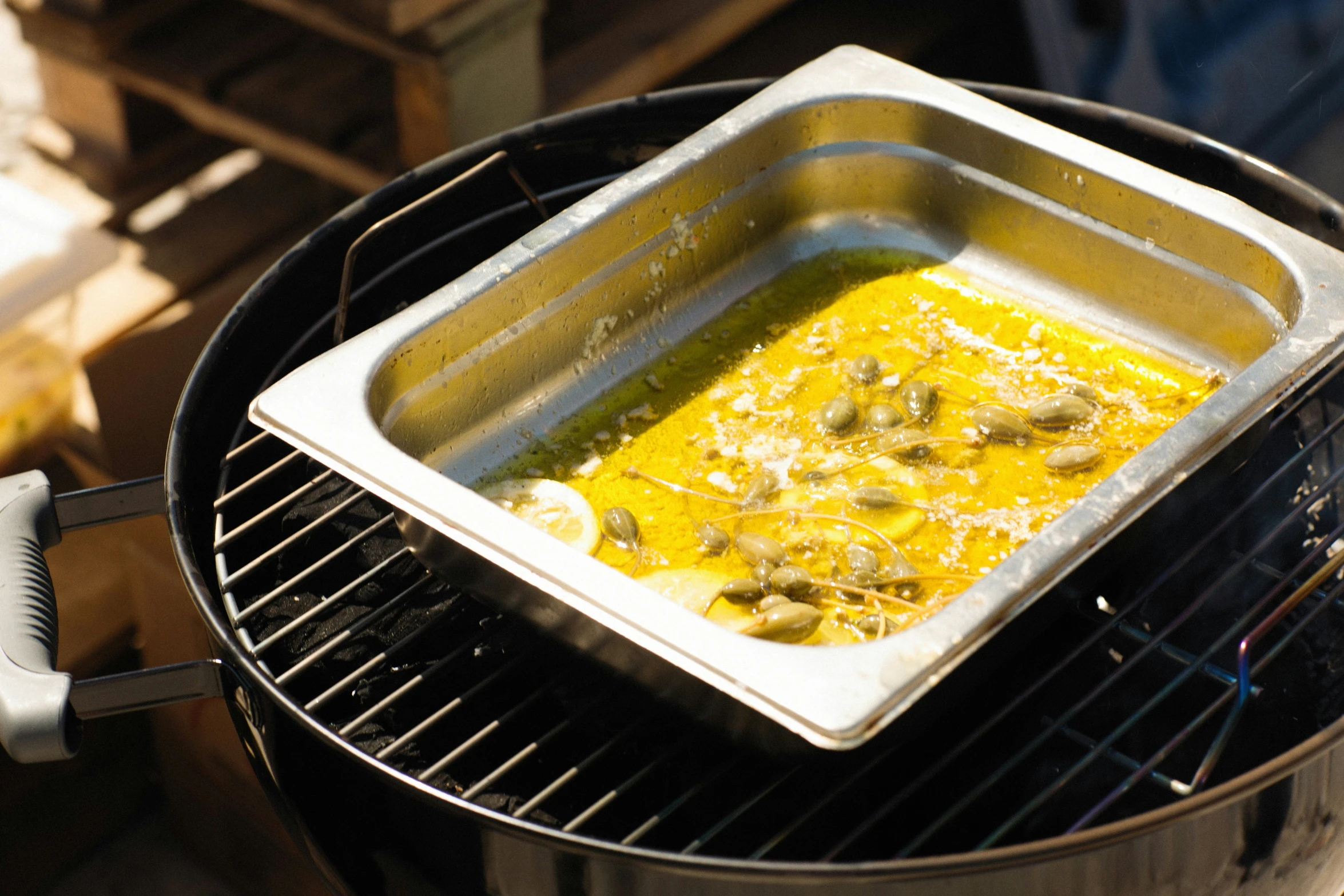 a pot with some food cooking on top of a grill