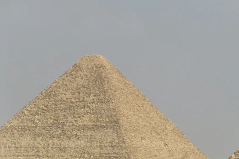 a tall sphinx with a clock on the side