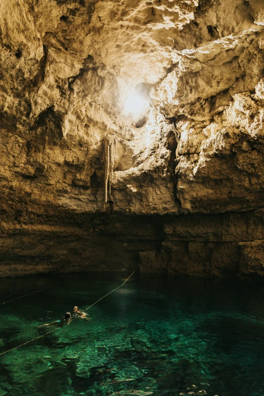 a man swims in the shallow waters of a lake