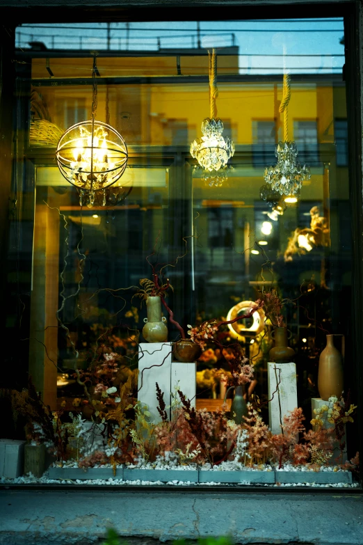a window display with many candles and decorative objects