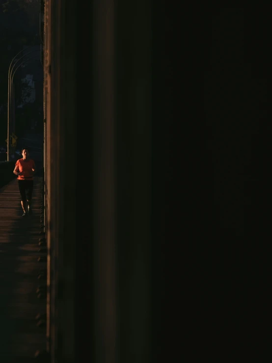 two women running at night under street lamps