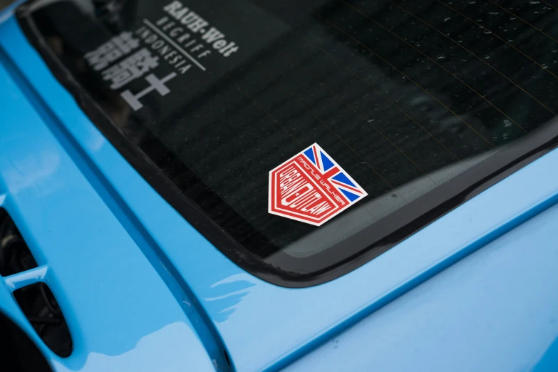 a sticker that says union jack on a blue car