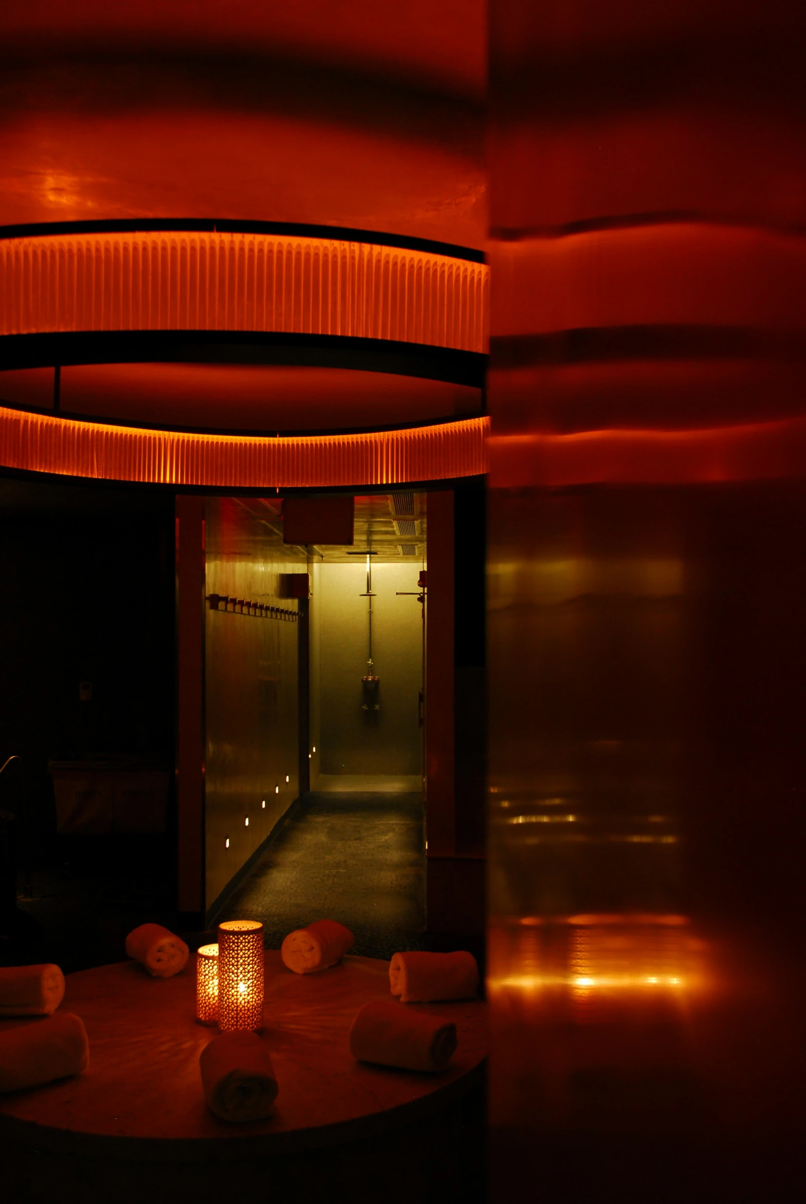 an dimly lit restaurant with a candle on the table