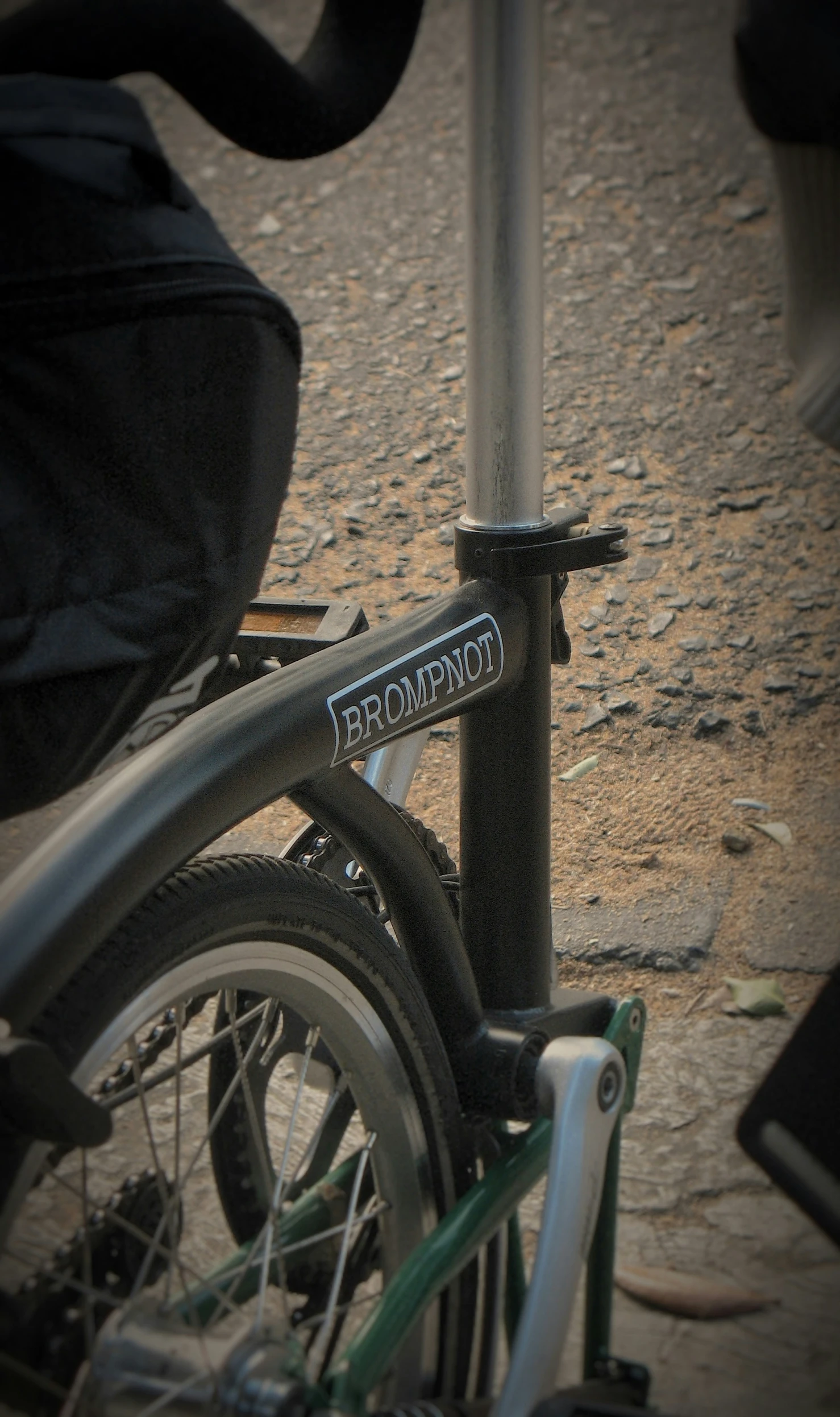 there is an unusual metal object and two bicycles parked by it