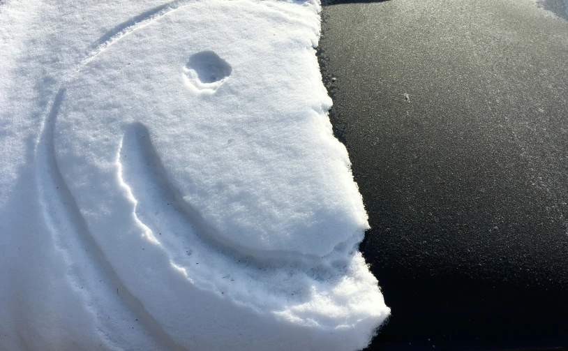 a car windshield with a smiley face painted on it