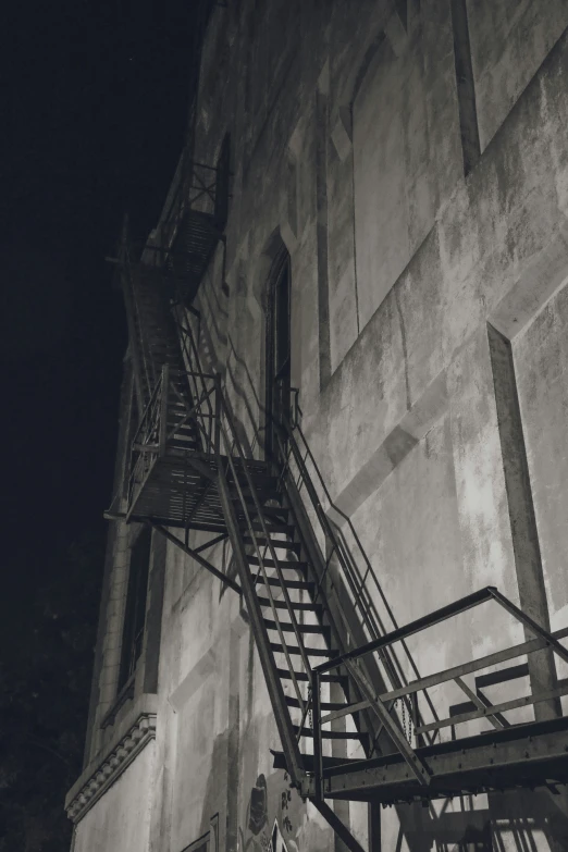 a fire escape with stair and a fire hydrant