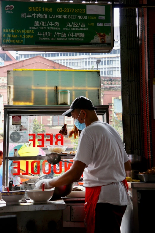 a person in a restaurant near a building