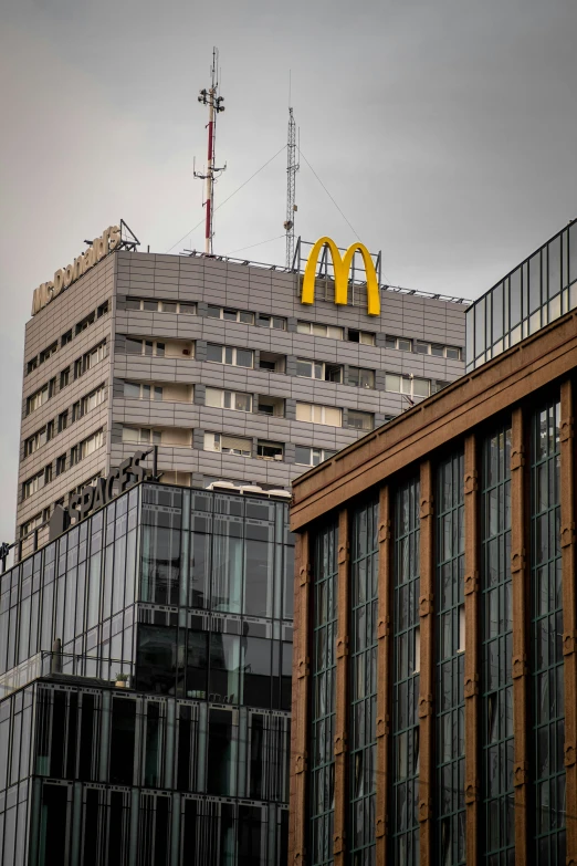 a yellow mcdonald logo on top of some building