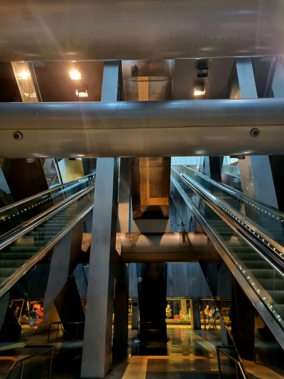 an overhead view of a large building with lots of escalators