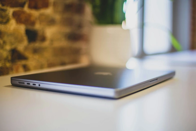 a laptop computer sitting on top of a table