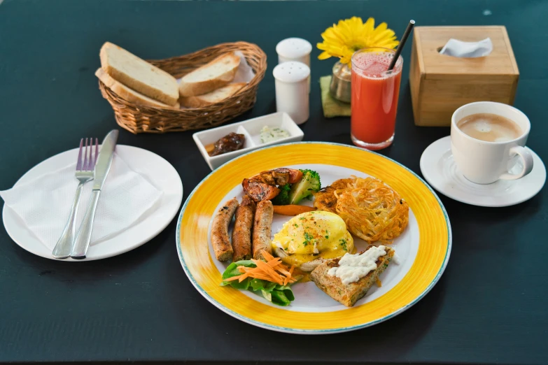 a table with plates and cups filled with food