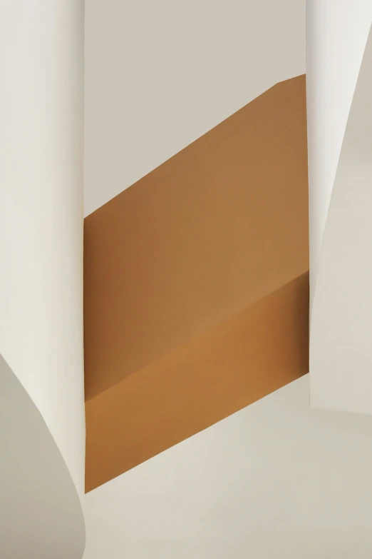 an abstract artwork with an irregular shaped white and beige area