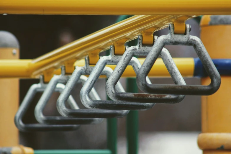 colorful children's playground equipment on steel poles and plastic bars