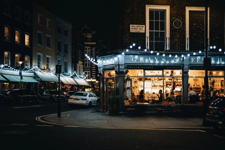 an outdoor shop selling christmas lights and presents