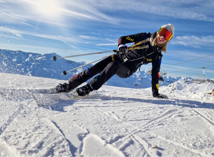 a man is leaning on skis in the snow