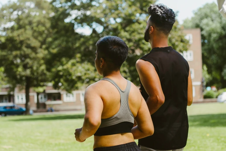 a man and woman looking at soing in the distance