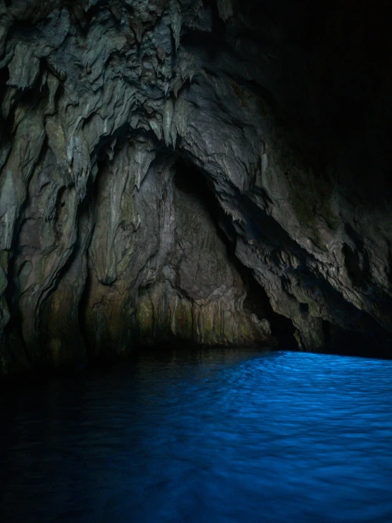 a close up of an ocean area with a rock wall