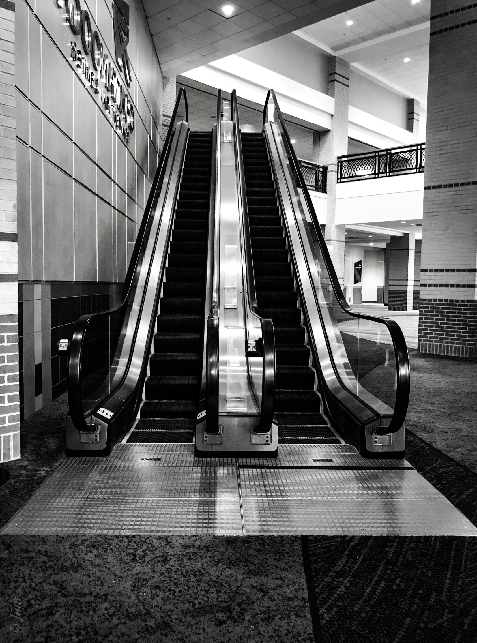 black and white po of an escalator