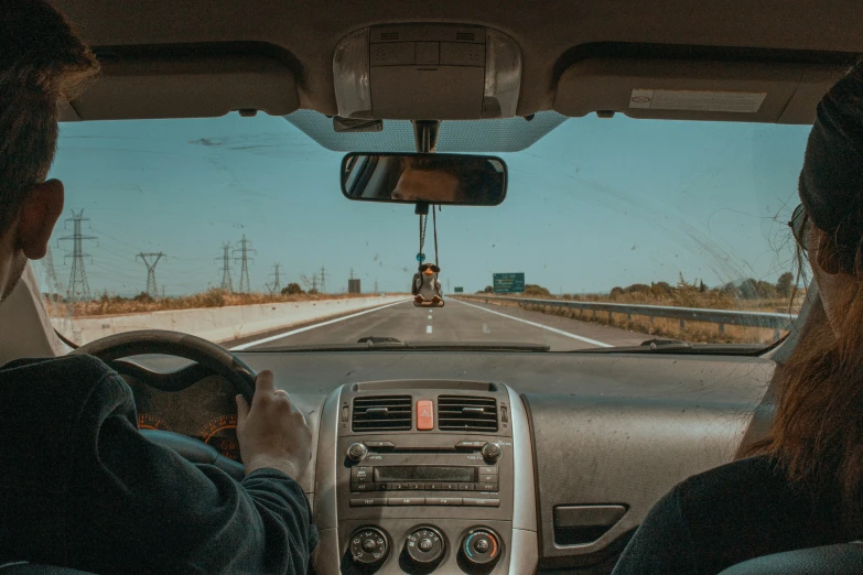 the back of a car driving down a highway