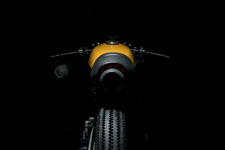 a yellow black and white motorcycle and its tire