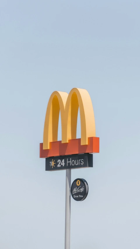 the large mcdonald's sign is clearly visible in the air