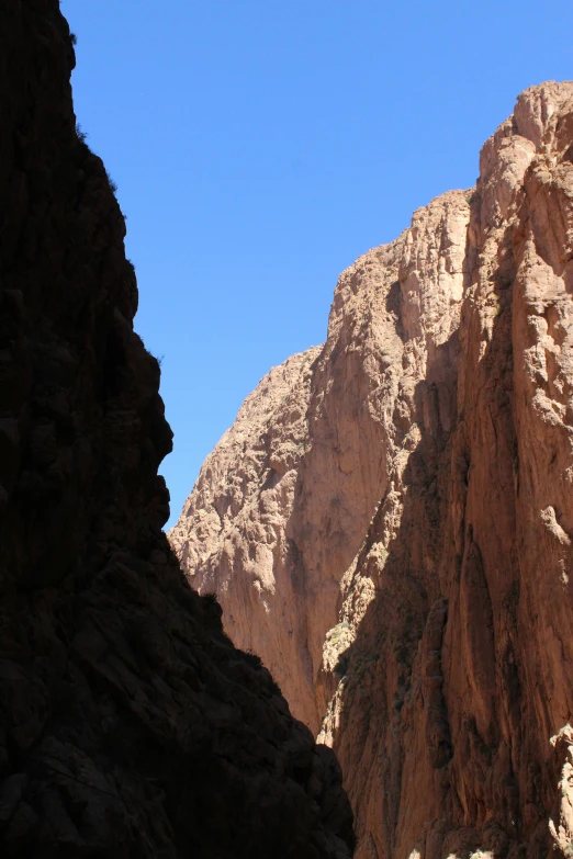 a tall mountain with some very skinny rocks