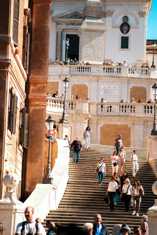 a group of people walking up some steps