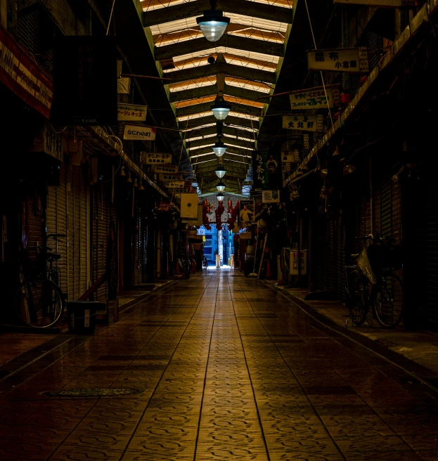 a narrow street lined with store fronts in an asian country