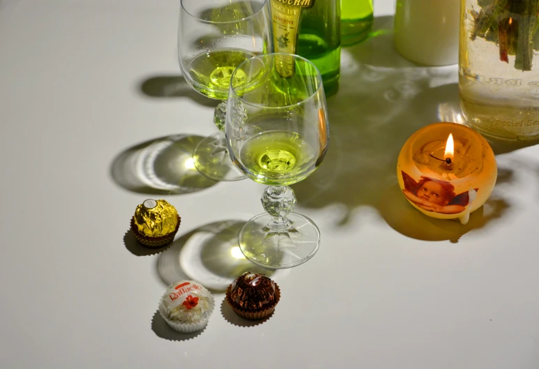 an array of alcohol cups, and glasses on a table