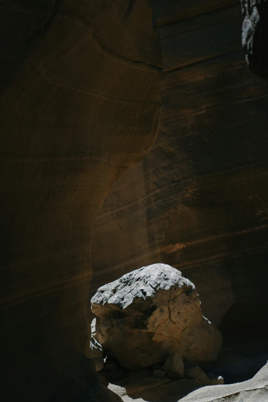 a rock in the desert is covered by snow