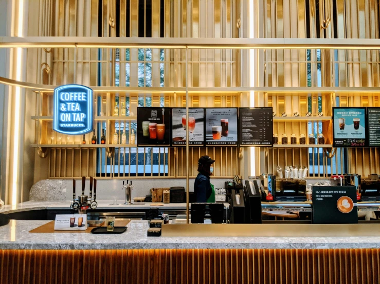 the bar in a cafe has a long wooden wall