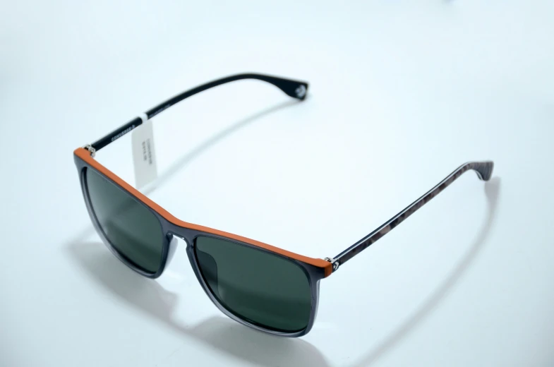 a pair of sunglasses is shown with two colors