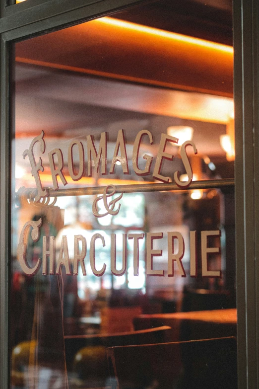 a restaurant window shows the name of a steak house
