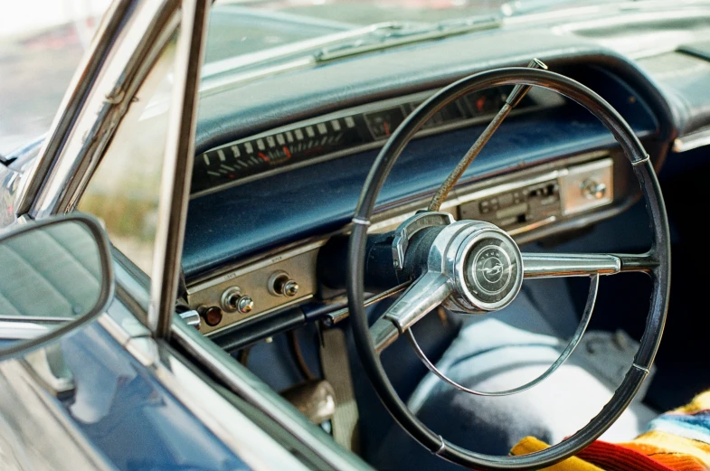 dashboard view of a car with its steering wheel and radio