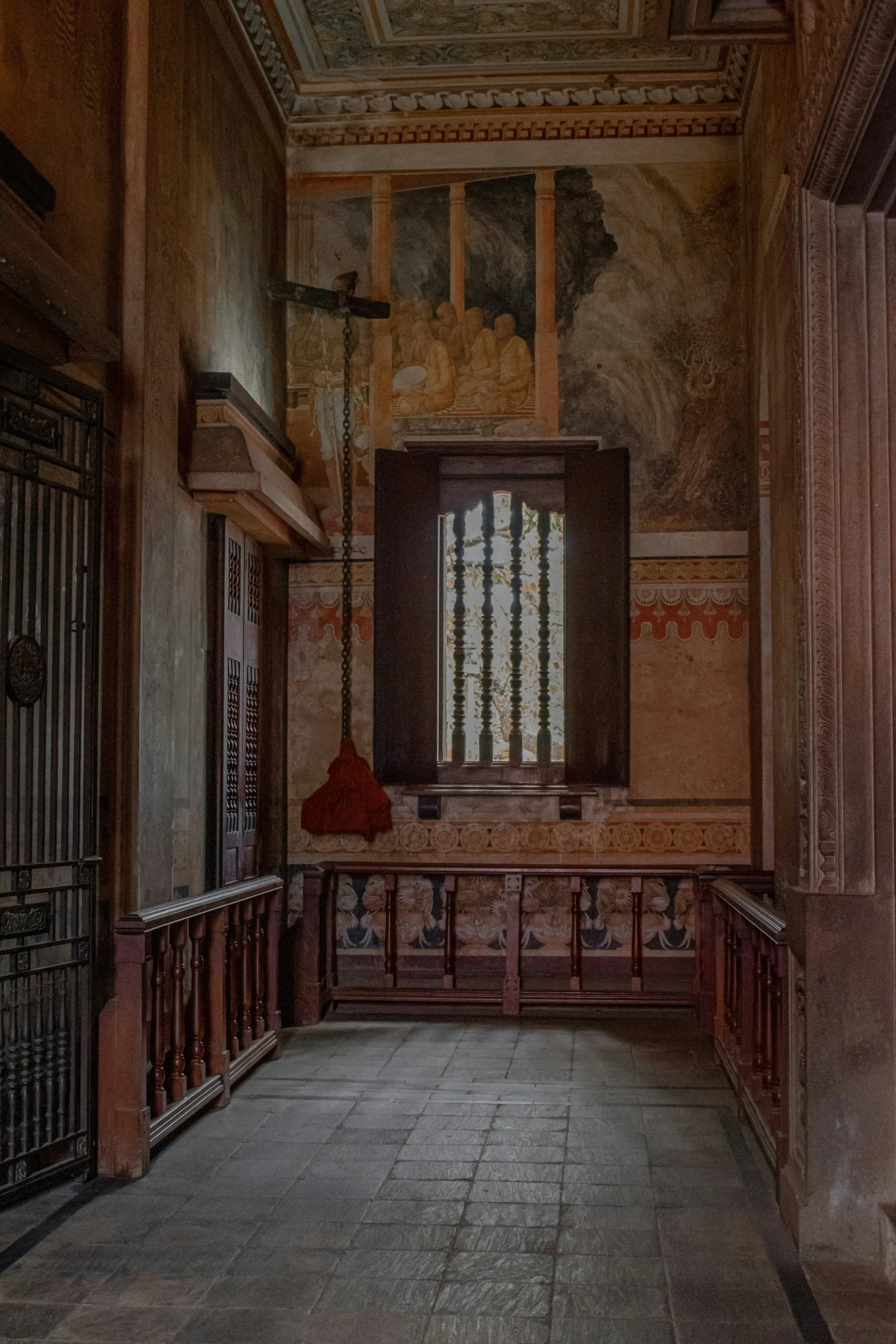 an old room with a large stained window