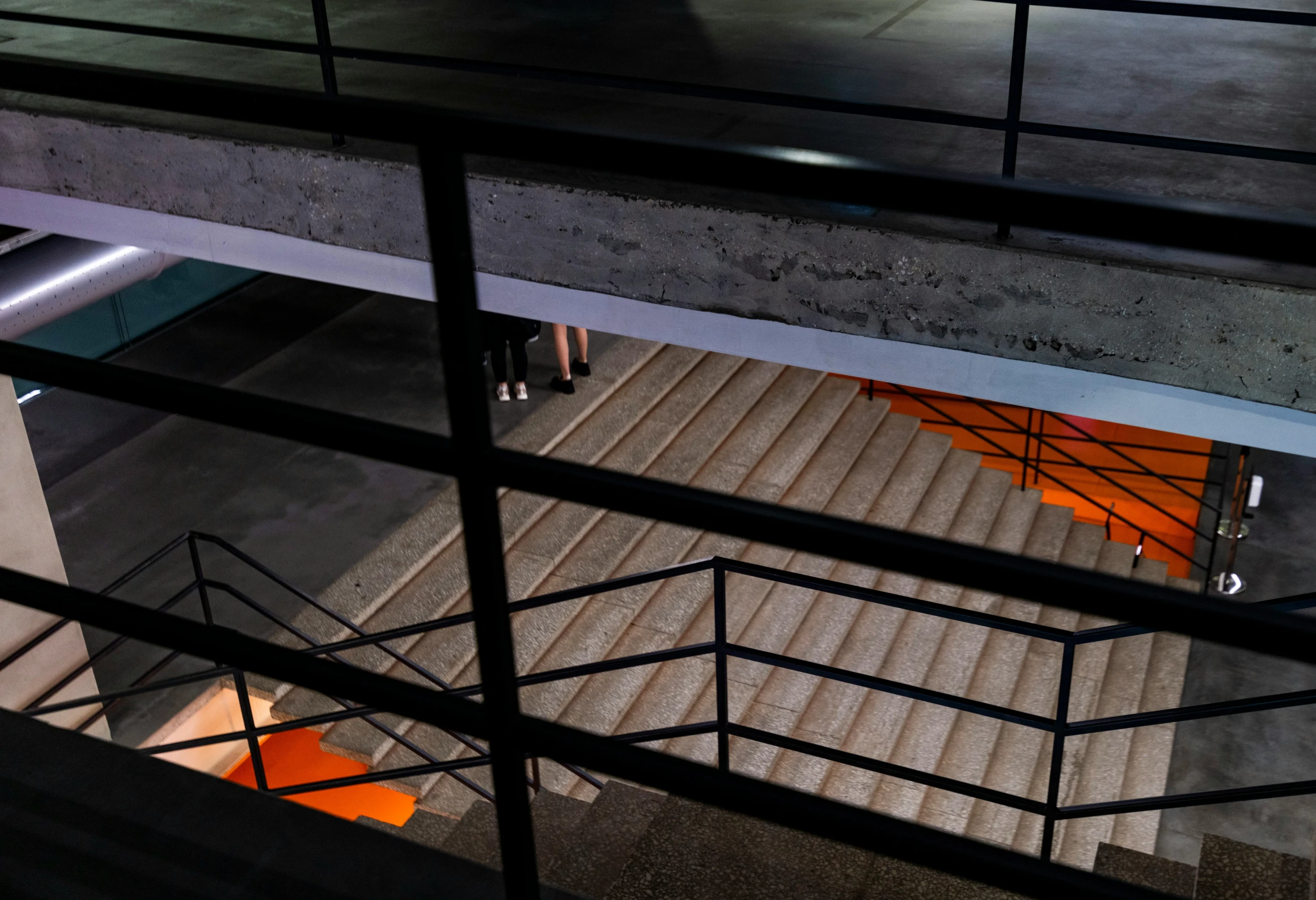 a view down an elevated stairway looking down into the night