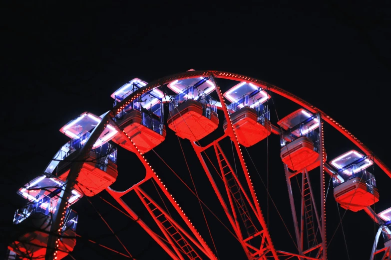 red and blue ferris wheel at night time