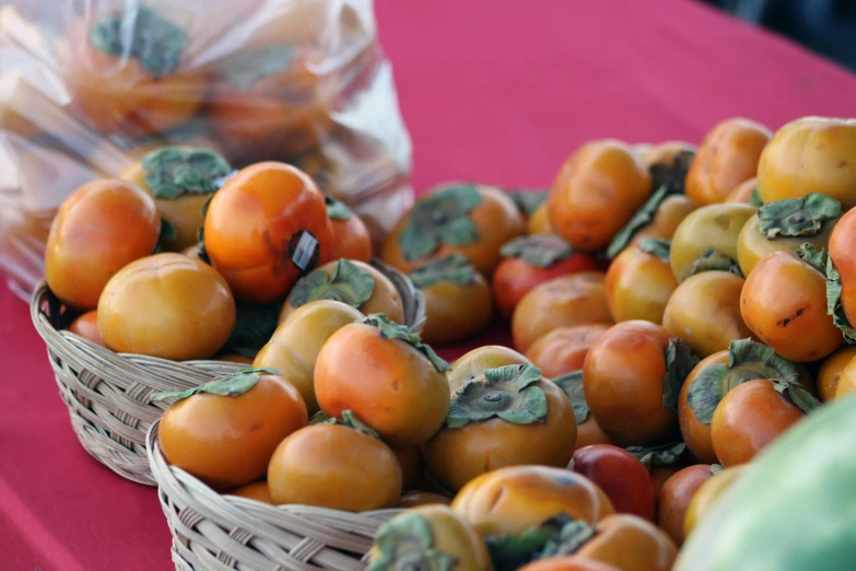 several small baskets filled with fruit next to each other