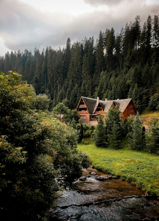 a small stream with a house in the background