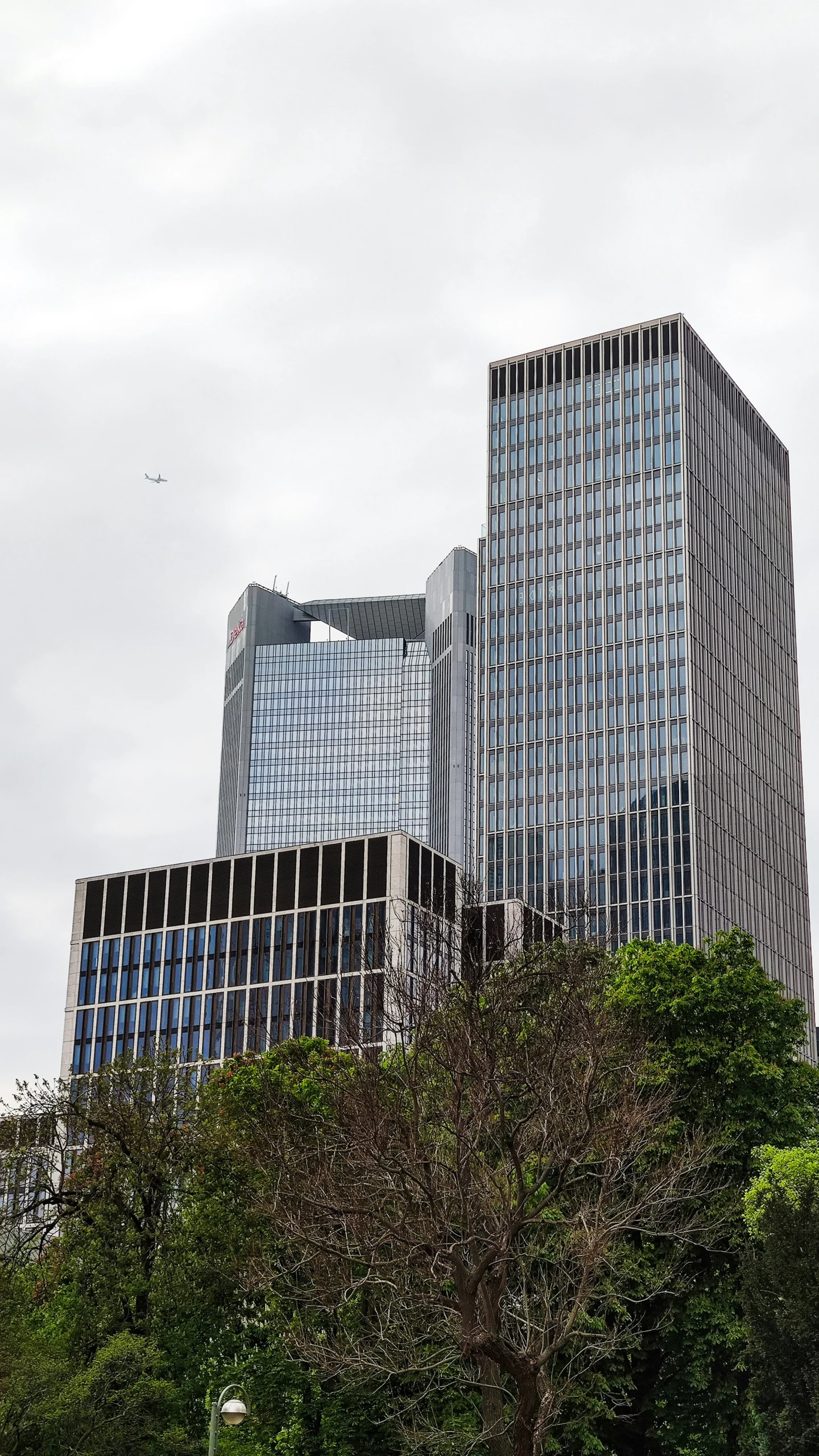 the building in the foreground is one of several high rise towers