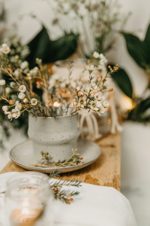 two small jars hold flowers in it