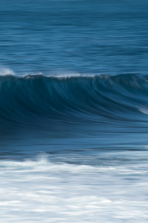 a person on a surf board riding a wave