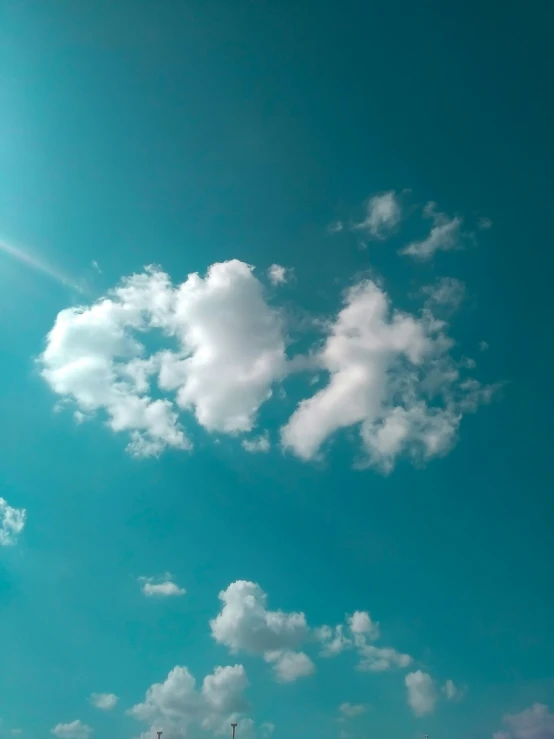 a big open blue sky with some clouds above