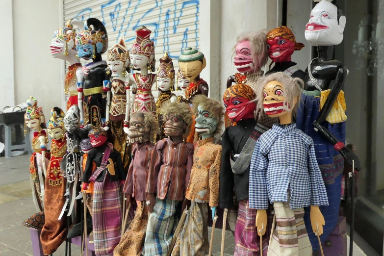 souvenirs and masks on display outside a building